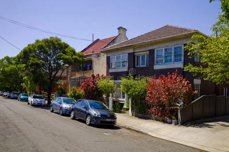 Sydney suburban street lined with homes reflecting the city's constrained land supply and affordability pressures.